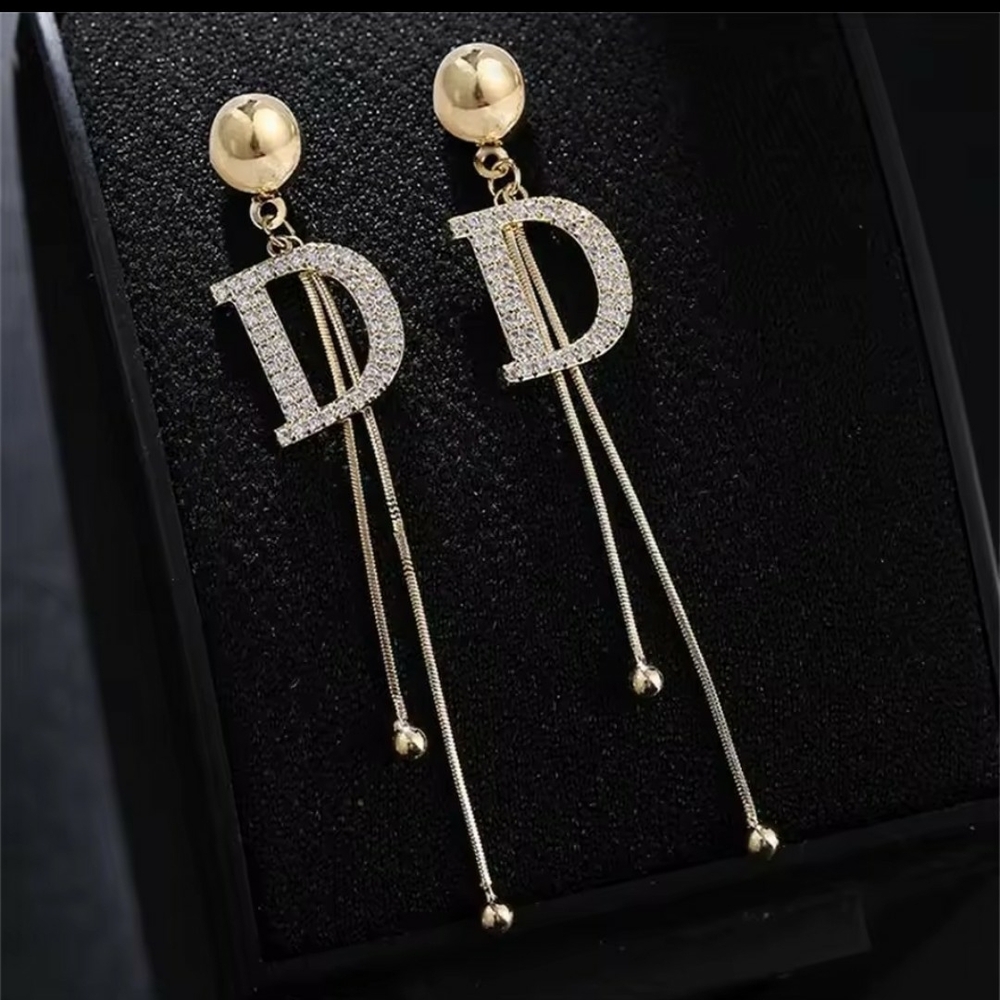 Gold Modern Dangle Earrings with Stylized Design